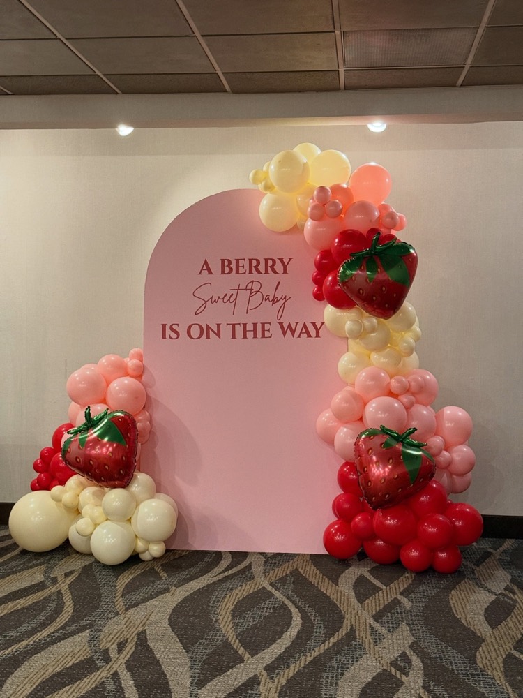 Berry Sweet baby shower display with strawberry balloons