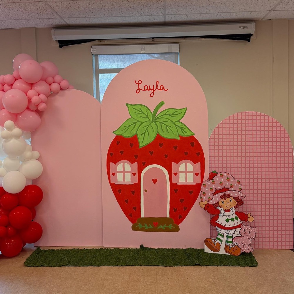 Strawberry Shortcake birthday display with custom painted mural